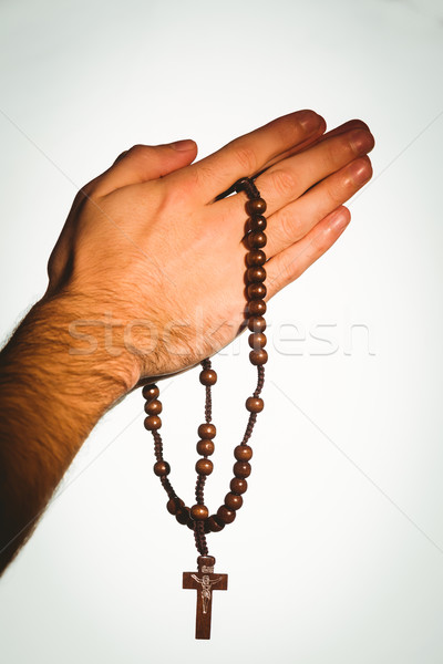 Hand holding wooden rosary beads Stock photo © wavebreak_media