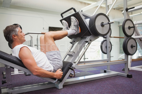 Fit man using weights machine for legs Stock photo © wavebreak_media