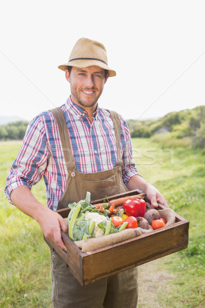 Happy farmer carrying box of veg Stock photo © wavebreak_media