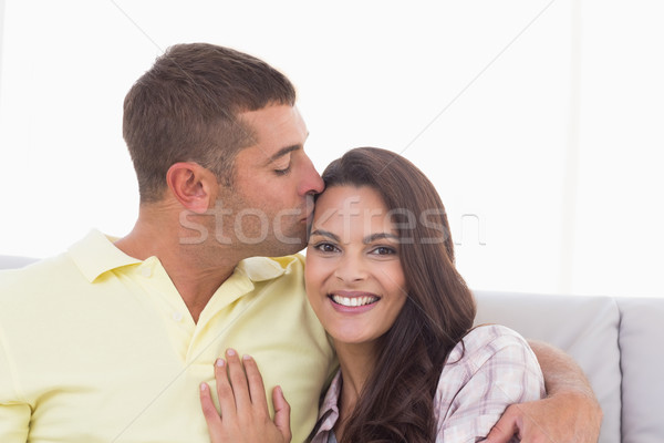 Happy woman being kissed by man Stock photo © wavebreak_media