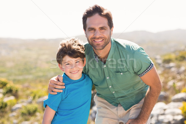 Stock photo: Father and son hiking through mountains
