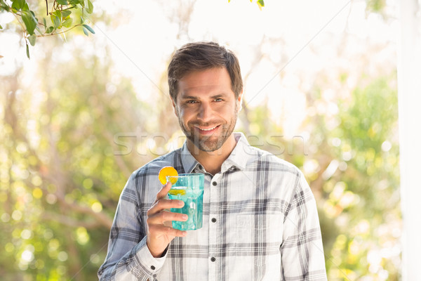 Mutlu adam gülen kamera içmek Stok fotoğraf © wavebreak_media