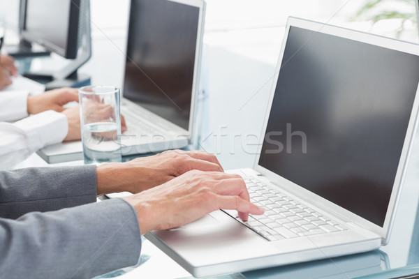 [[stock_photo]]: Gens · d'affaires · utilisant · un · ordinateur · portable · bureau · femme · heureux · technologie