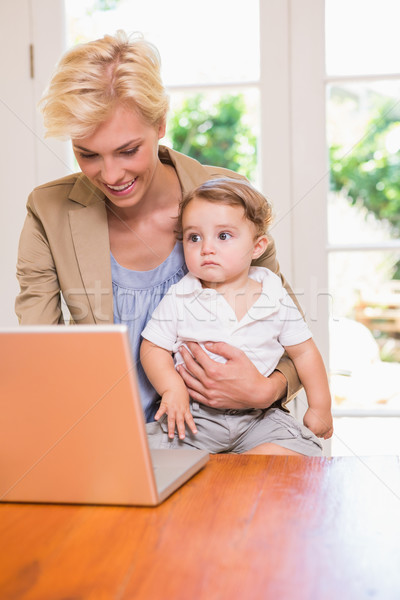 Stock photo: Pretty blonde woman with his son using laptop