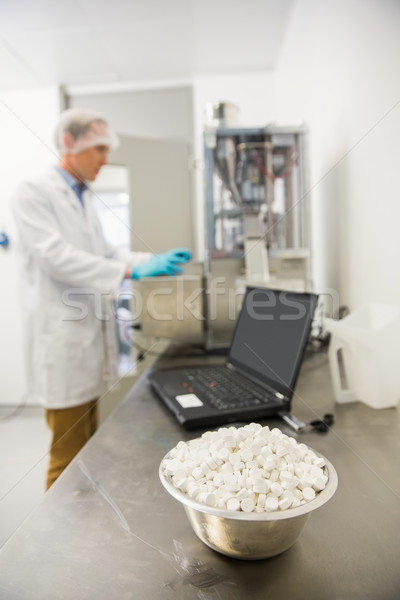 Pharmacist using heavy machinery to make medicine Stock photo © wavebreak_media