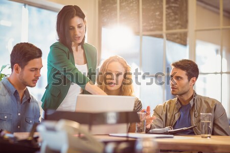 Group of young colleagues using laptop Stock photo © wavebreak_media