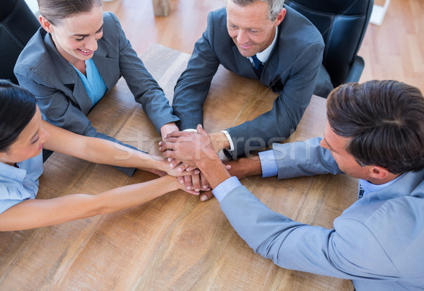 Business people joining hands in a circle Stock photo © wavebreak_media