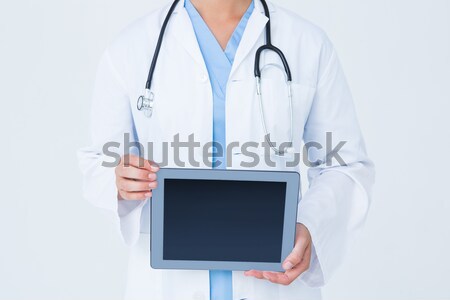 Doctor holding a digital tablet in corridor at hospital Stock photo © wavebreak_media