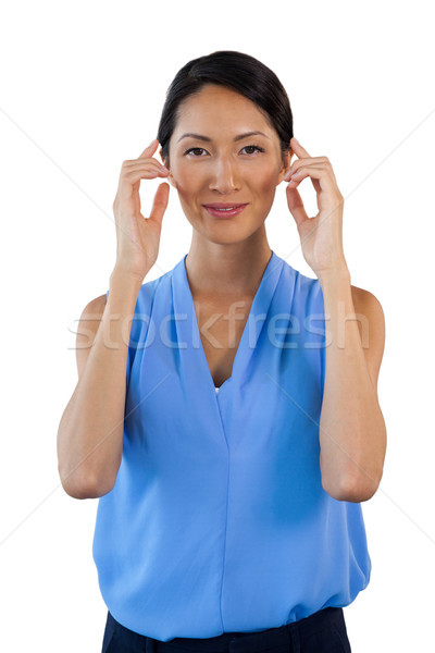 Portrait of smiling businesswoman adjusting imaginary eyeglasses Stock photo © wavebreak_media