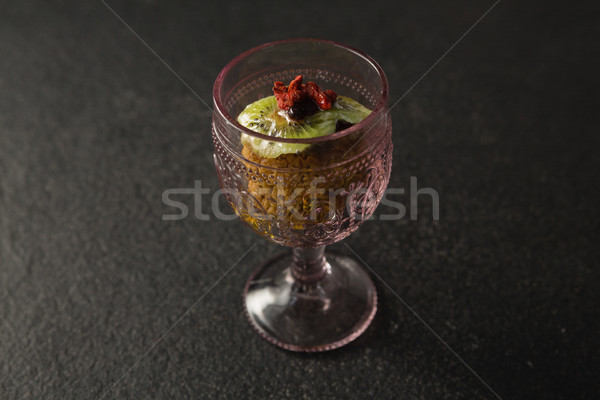 Stock photo: Dried fruits and granola bar in glass