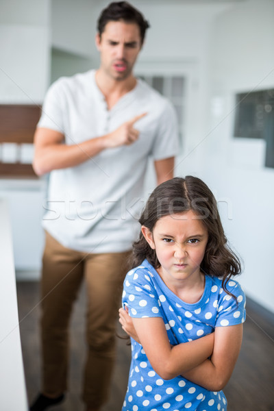 Portrait of angry daughter with arms crossed Stock photo © wavebreak_media