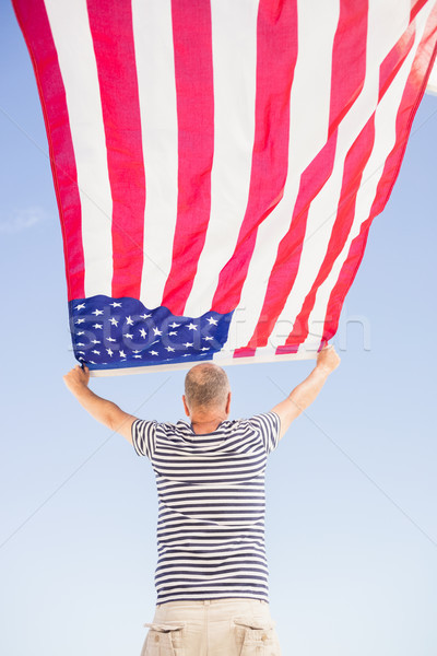 Senior man holding american flag Stock photo © wavebreak_media