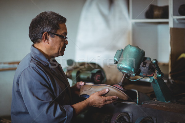 Shoemaker polishing a shoe with machine Stock photo © wavebreak_media