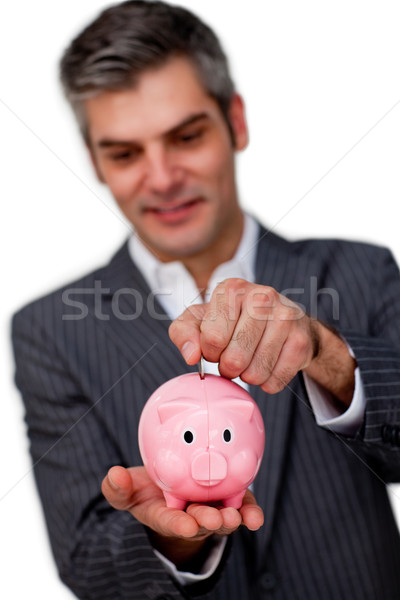 Sophisticated male executive saving money in a piggybank Stock photo © wavebreak_media