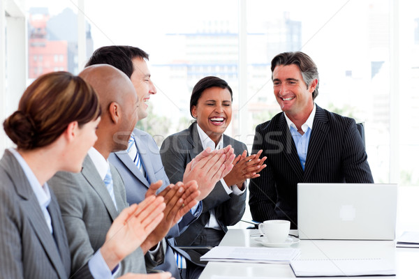 Smiling multi-ethnic business team applauding Stock photo © wavebreak_media
