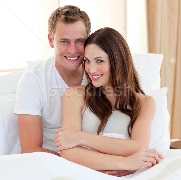 Stock photo: Intimate lovers embracing lying in bed