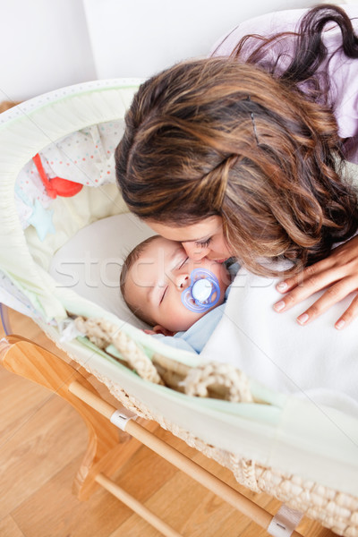 Kind young mother taking care of her adorable baby at home Stock photo © wavebreak_media