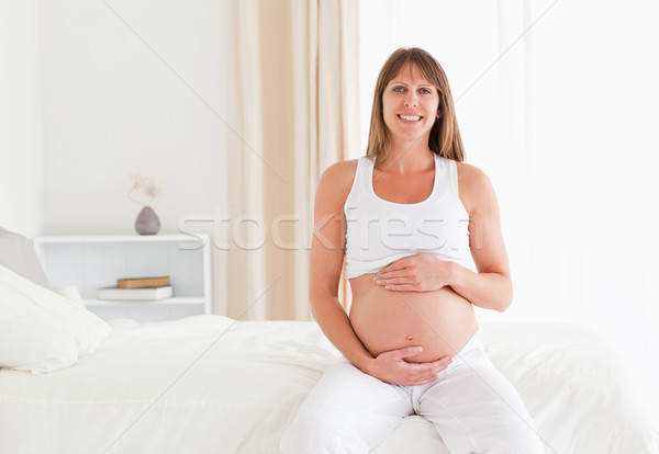 Stock foto: Schönen · schwanger · weiblichen · Bauch · Sitzung · Bett