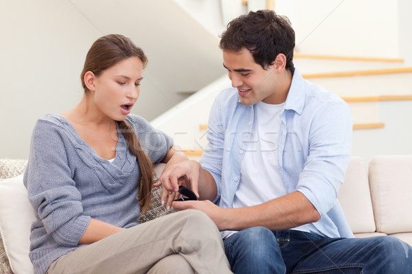 Man proposing marriage to his girlfriend in their living room Stock photo © wavebreak_media