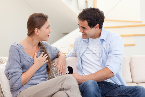 Young man proposing marriage to his girlfriend in their living room Stock photo © wavebreak_media