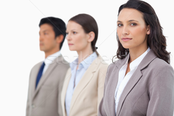 Businesswoman with colleagues next to her against a white background Stock photo © wavebreak_media