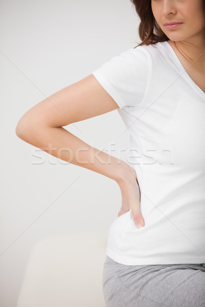 Femme douloureux hanche séance chambre [[stock_photo]] © wavebreak_media