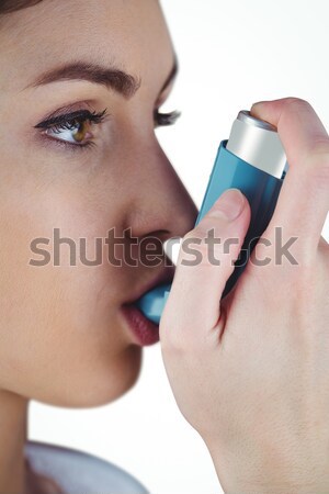Woman with asthma using an asthma inhaler for preventing attacks Stock photo © wavebreak_media