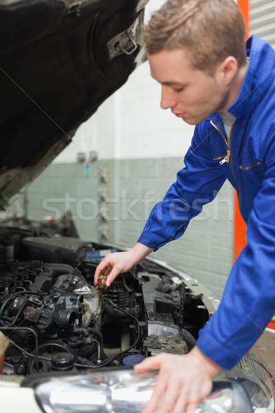 Mechanic checking car engine oil Stock photo © wavebreak_media