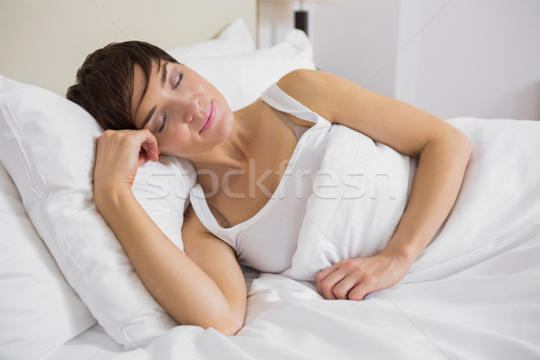 Attractive woman sleeping in bed Stock photo © wavebreak_media