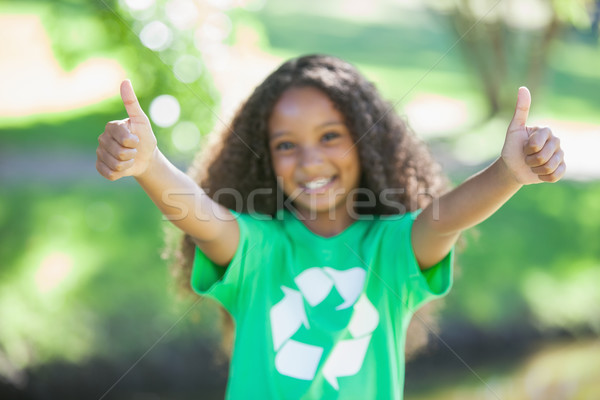 Young environmental activist smiling at the camera showing thumb Stock photo © wavebreak_media