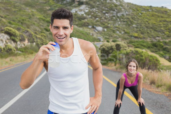 Portrait of a fit couple standing on road Stock photo © wavebreak_media