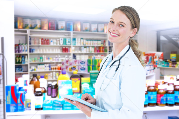 Stock photo: Composite image of doctor using tablet pc