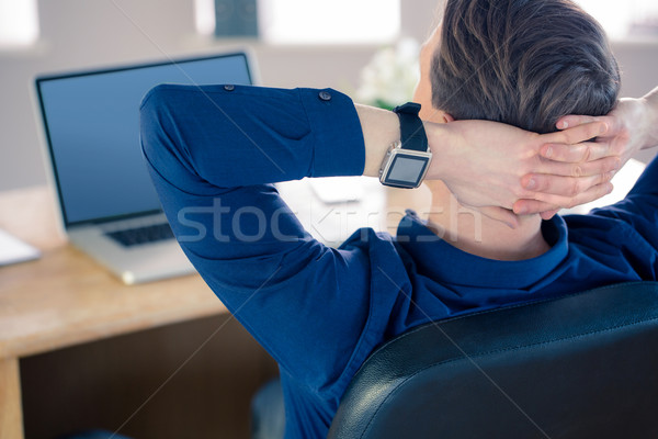 Rear view of businessman relaxing in a swivel chair  Stock photo © wavebreak_media