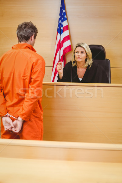 Judge and criminal speaking in front of the american flag Stock photo © wavebreak_media
