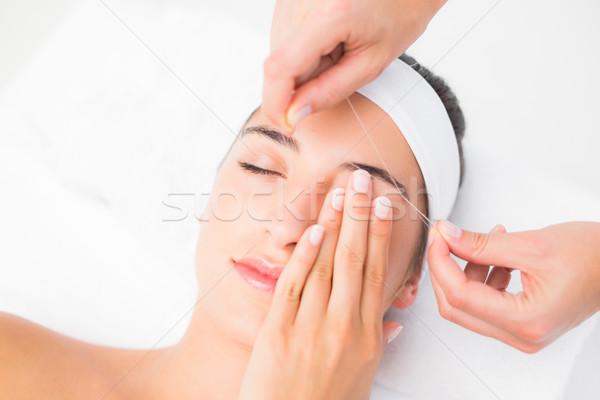 Hands threading beautiful womans upper eyes Stock photo © wavebreak_media