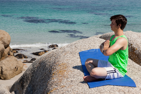 Stockfoto: Man · yoga · rock · kust · hemel