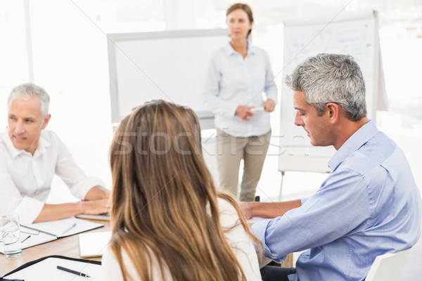 Iş adamları dinleme tanıtım ofis adam toplantı Stok fotoğraf © wavebreak_media