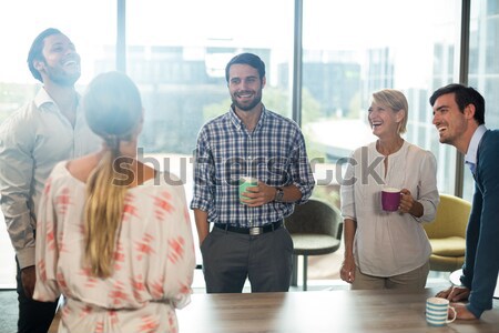 Tensed senior man with friends in background Stock photo © wavebreak_media