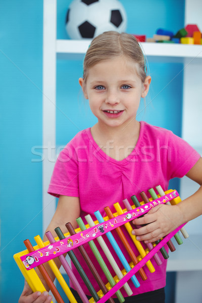 Lächelnd Mädchen halten Xylophon Schreibtisch glücklich Stock foto © wavebreak_media