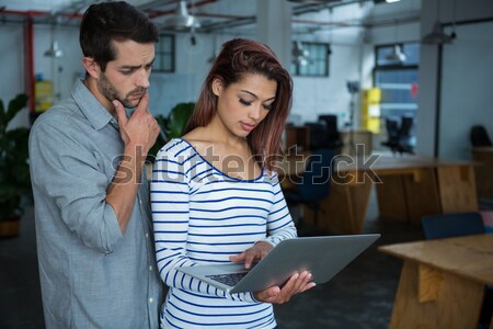 Stock photo: Male and female potter using digital tablet