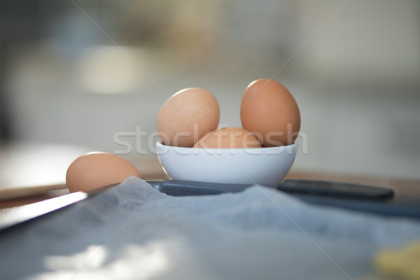 Bowl of eggs on kitchen worktop Stock photo © wavebreak_media