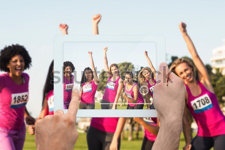 Friends cheering man doing chin-ups  Stock photo © wavebreak_media