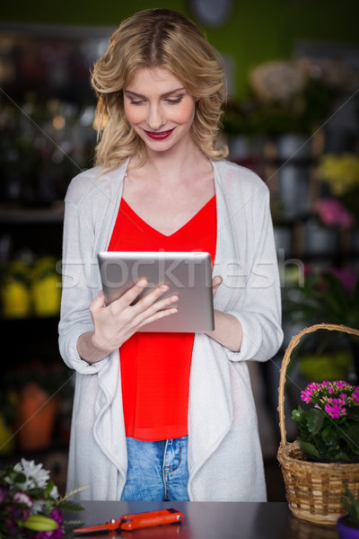 Happy female florist using digital tablet Stock photo © wavebreak_media