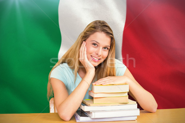 Stock photo: Composite image of portrait of female student in library