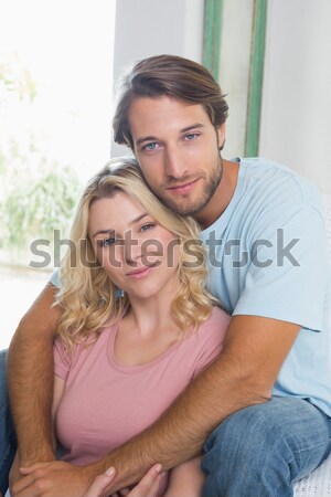 Portrait of happy lovers hugging in their bed Stock photo © wavebreak_media