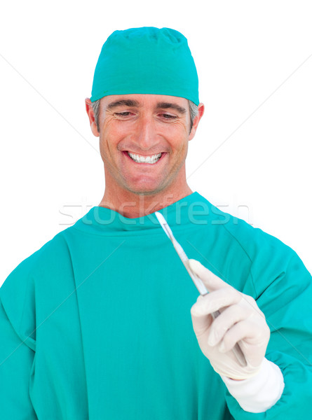 Lächelnd Chirurg halten Skalpell weiß medizinischen Stock foto © wavebreak_media