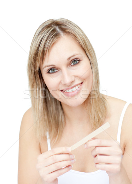 Portrait of a charming woman filing her nails Stock photo © wavebreak_media