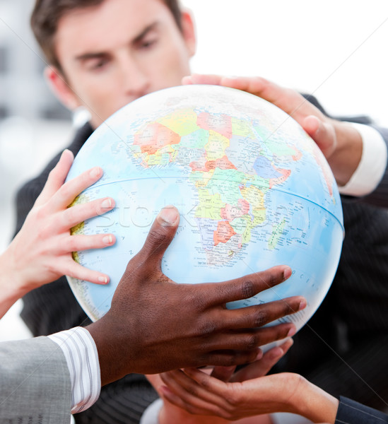 Close-up of a business team holding a terrestrial globe Stock photo © wavebreak_media