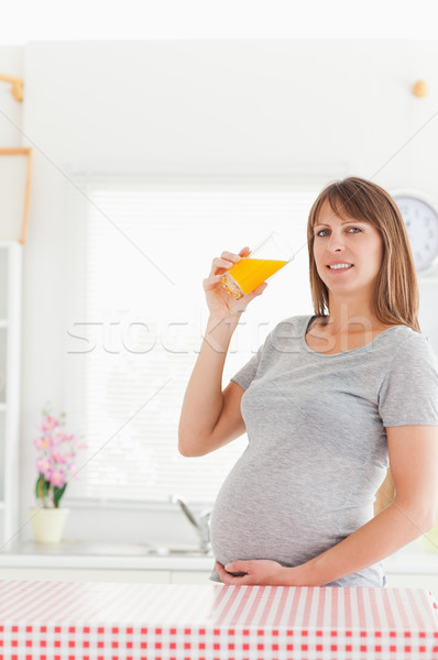 Stockfoto: Mooie · zwangere · vrouw · sinaasappelsap · permanente · keuken