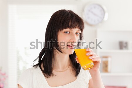 sad woman with orange juice and handkerchief in livingroom Stock photo © wavebreak_media